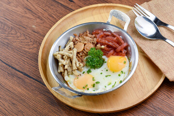 A delicious Japanese meal with rice, pork, and various side dishes.