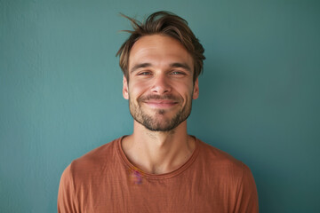 Fototapeta premium A close up portrait of a young man with a subtle smile