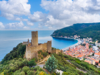 Fototapeta premium Aerial view of Monte Ursino Castle in the old village of Noli on the Italian Riviera. Noli, Ligury, Italy