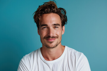 Fototapeta premium A close up portrait of a young man with a subtle smile