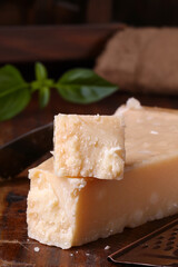 hard parmesan cheese on a wooden board