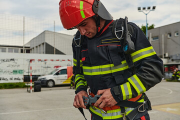 Professional Firefighter Suits Up in Full Gear for Duty