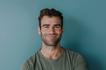 Obraz premium A close up portrait of a young man with a subtle smile