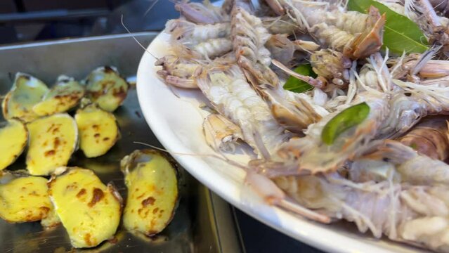 Odontodactylus scyllarus is a species of large predatory stomatopod crustacean from the family Odontodactylidae. Boiled sea mantis. Stuffed oyster shells with cheese