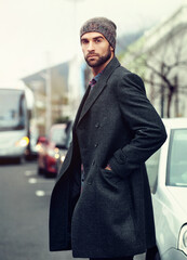 Man, winter and fashion thinking in city or outside, trendy and walking in urban downtown with...