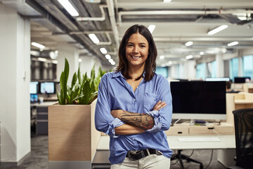 Office, smile and businesswoman in portrait with arms crossed, confidence and person in workplace. About us, pride and startup company with happy entrepreneur for empowerment in career or profession.