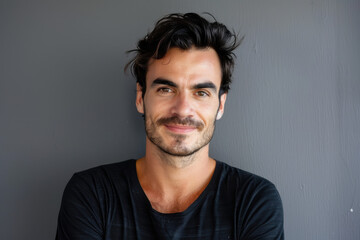 Fototapeta premium A close up portrait of a young man with a subtle smile