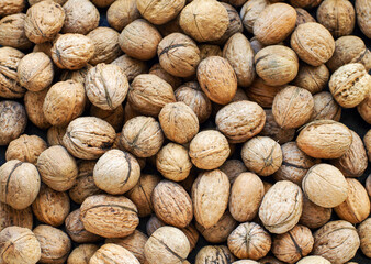 Top view of whole walnuts as background texture
