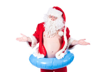 Vacations and holidays. Funny Santa Claus with an inflatable ring dreams of the sea. White background.