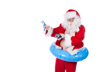 Vacations and holidays. Funny Santa Claus with an inflatable ring dreams of the sea. White background.
