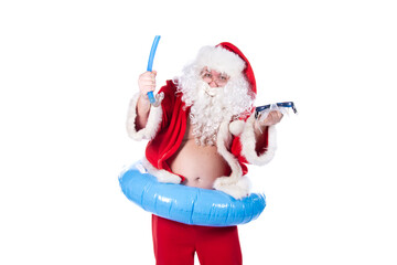 Vacations and holidays. Funny Santa Claus with an inflatable ring dreams of the sea. White...