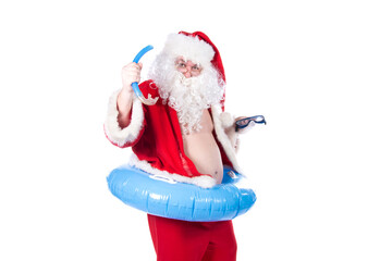 Vacations and holidays. Funny Santa Claus with an inflatable ring dreams of the sea. White...