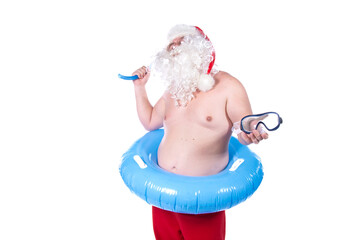 Vacations and holidays. Funny Santa Claus with an inflatable ring dreams of the sea. White background.