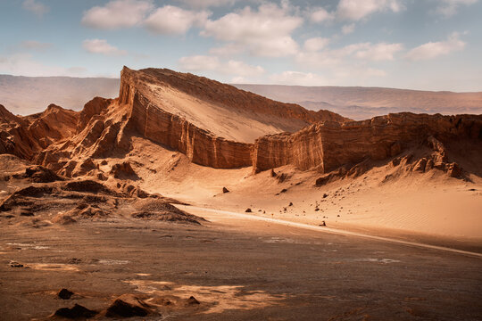 The Amphitheater, a huge red rock protruding from the earth in the middle of Moon Valley (Valle de la Luna), San Pedro de Atacama, Chile.