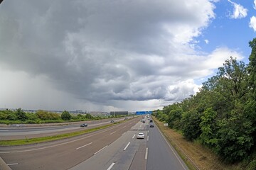 Picture of an approaching thunderstorm over Frankfurt Airport with highway