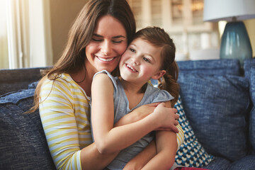 Fototapeta premium Hug, mother or child love on sofa home for trust, bonding and support of relationship memory. Smile, woman and girl as family for care, security or relax with embrace on couch for development