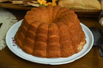 cake on a wooden table, cake on a plate, breakfast table, afternoon tea, simple cake, homemade cake, fluffy cake, egg cake

