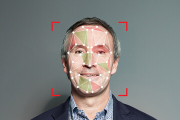 Mature man with Facial Recognition technology