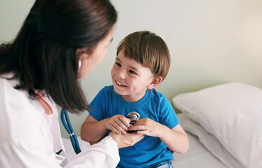 Doctor, stethoscope and child in hospital for healthcare, health and wellness with medical exam. Female pediatrician, assessment and patient in clinic for heart, lungs and cardiology with breathing