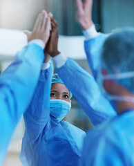Doctors, high five and healthcare for surgical procedure success with PPE and group in hospital...