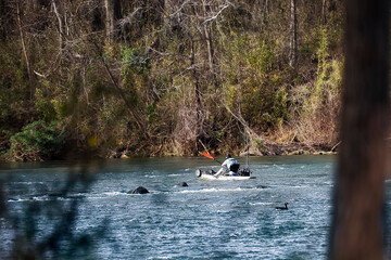 Man fishing in a kayak on the Catawba river in South Carolina.