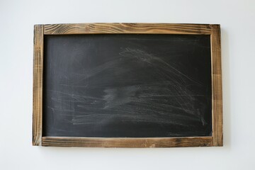 An empty chalkboard with a black surface and a wooden frame on a white background