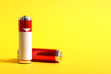 Two salt batteries are on a yellow background.
