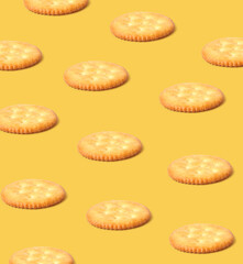 Creative layout made of cracker cookies on the yellow background. Food concept. Macro concept.