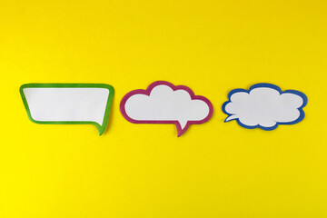 Three speech bubbles with different shapes and colors