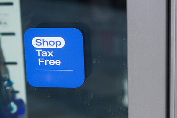 shop tax free text duty free shop sign on shop window 