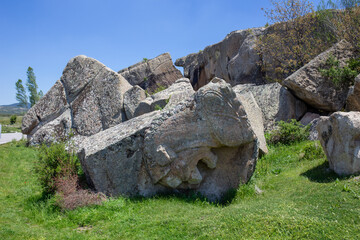 View of the lion reliefs carved into the main rock.