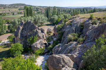 View of the residential areas, tombs and chapels carved from the bedrock in Ayazini Village in the Phrygian Valley