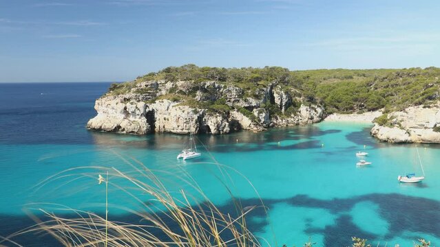 Macarelleta beach on Majorca island, Landscape of cliffs and coast of Balearic Islands, Spain. Beautiful clear water, white sand in a tiny bay, a place for holiday rest