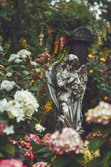 A serene depiction of an angel surrounded by vibrant flowers