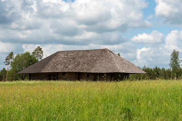 rural landscape with beautiful clouds and old wooden barn,