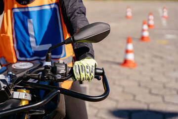 Riding between cones, lesson in motorcycle school