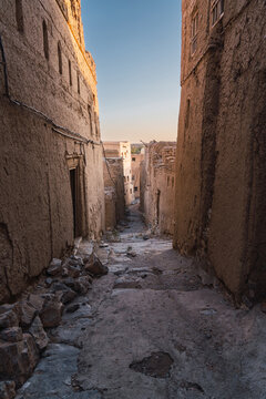 Ancient alley in Omani village at dusk