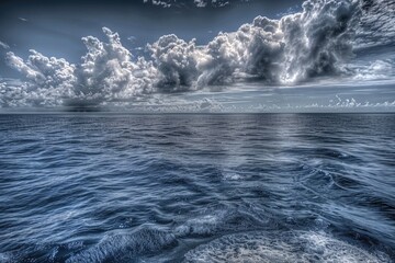 A serene scene of a large body of water under a cloudy sky, perfect for use in travel, nature, or relaxation-themed projects