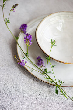 Minimalist summer table setting with wildflowers