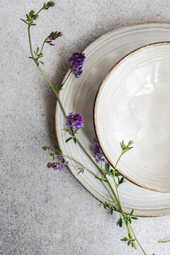 Minimalist summer table setting with wildflowers