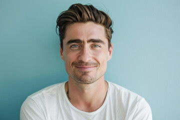 Fototapeta premium A close up portrait of a young man with a subtle smile