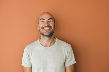 A close up portrait of a young man with a subtle smile