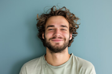 Obraz premium A close up portrait of a young man with a subtle smile