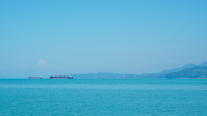 Fototapeta premium atumi seaport with stunning sea and mountain views, perfect for a serene escape.