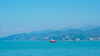 Fototapeta premium atumi seaport with stunning sea and mountain views, perfect for a serene escape.