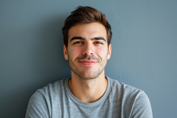 Fototapeta premium A close up portrait of a young man with a subtle smile
