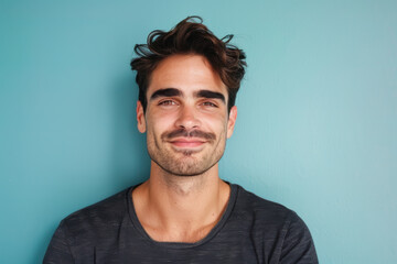 Fototapeta premium A close up portrait of a young man with a subtle smile