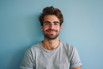 Obraz premium A close up portrait of a young man with a subtle smile