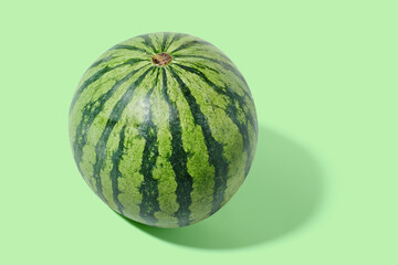 Watermelon on green pastel background