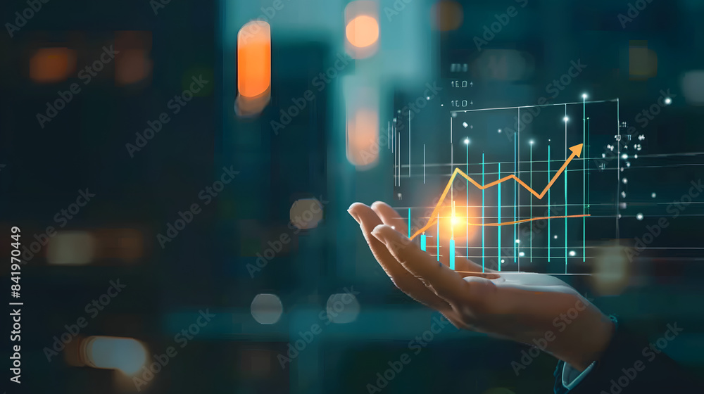 Poster a hand holds a chart with a growing up arrow and a graph of stock market or business growth on a vir